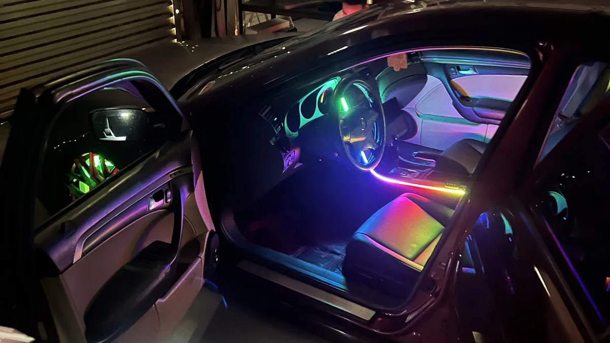 The production team films an interior lighting transformation